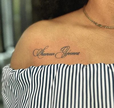 Delicate and minimalist fine line lettering tattoo displaying two names in an elegant, flowing cursive script across a person's collarbone.